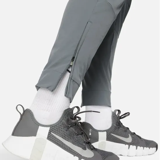 Спортивні штани Nike Dri-Fit Unlimited Tapered Leg FB7548-084