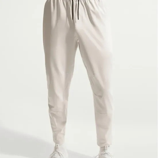 Спортивні штани Nike Dri-Fit Unlimited Tapered Leg FB7548-104