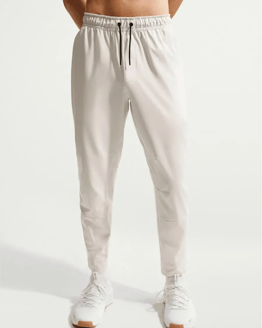 Спортивні штани Nike Dri-Fit Unlimited Tapered Leg FB7548-104
